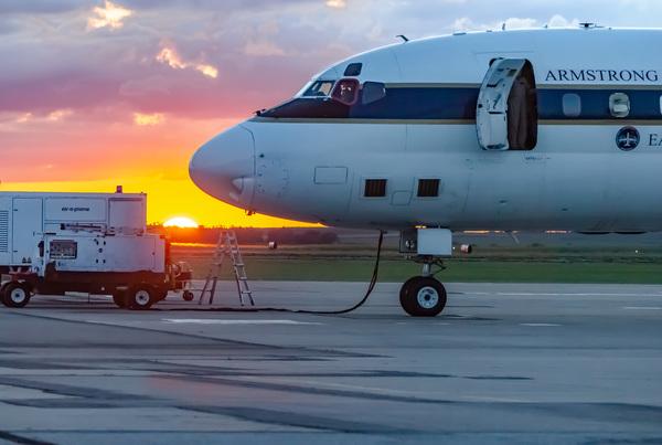 Preparing the DC-8 at sunrise. The ground cart is delivering electricity to the science instruments. Photo by Sam Hall.