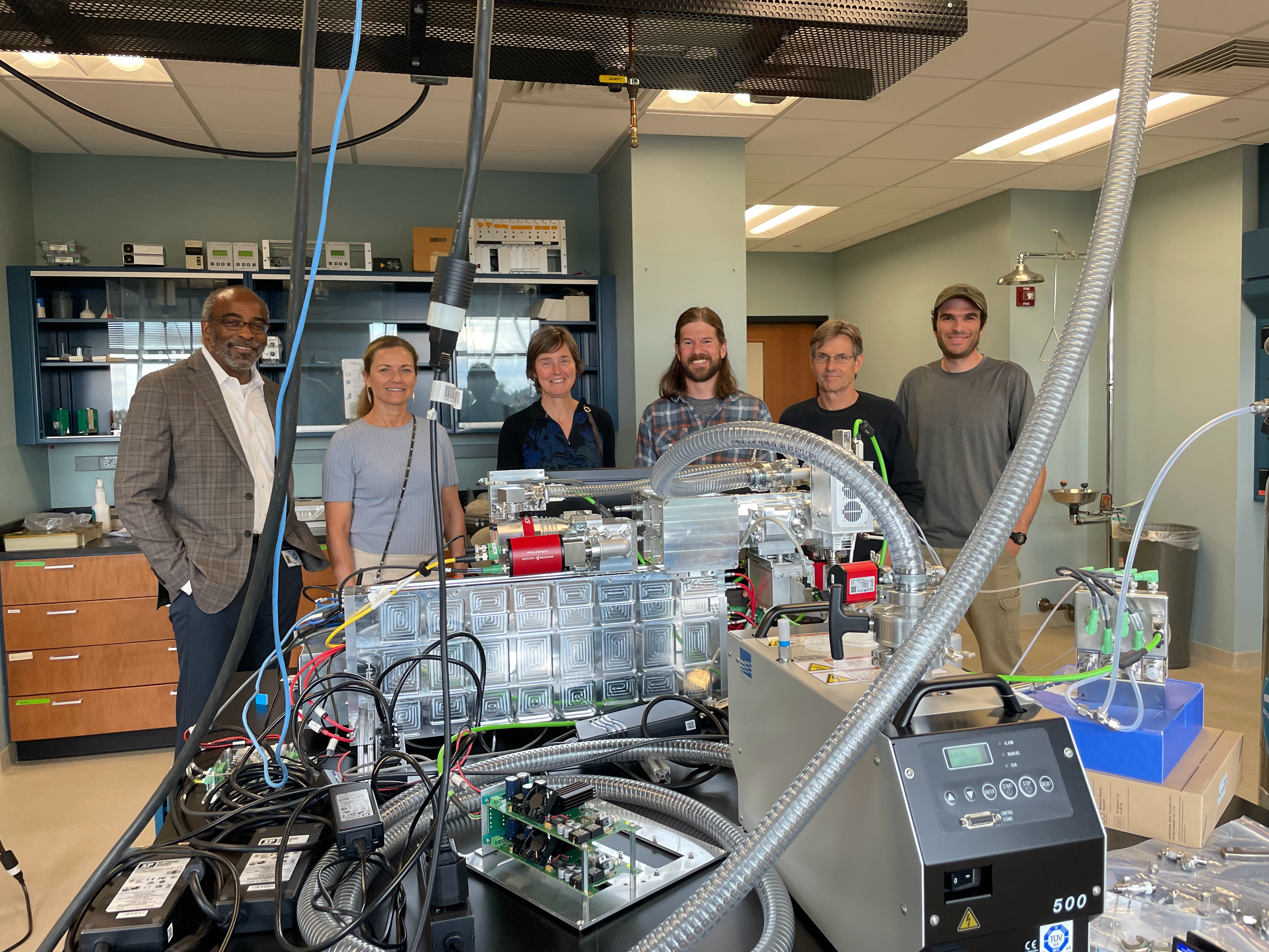 On hand to witness the already functioning instrument were, pictured left to right: NCAR Director Everette Joseph (host), Anne Johansen, ACOM Director Pieternel Levelt, Brett Palm (APROC Project lead), Eric Apel, and Kyle Zarzana (APROC scientist).