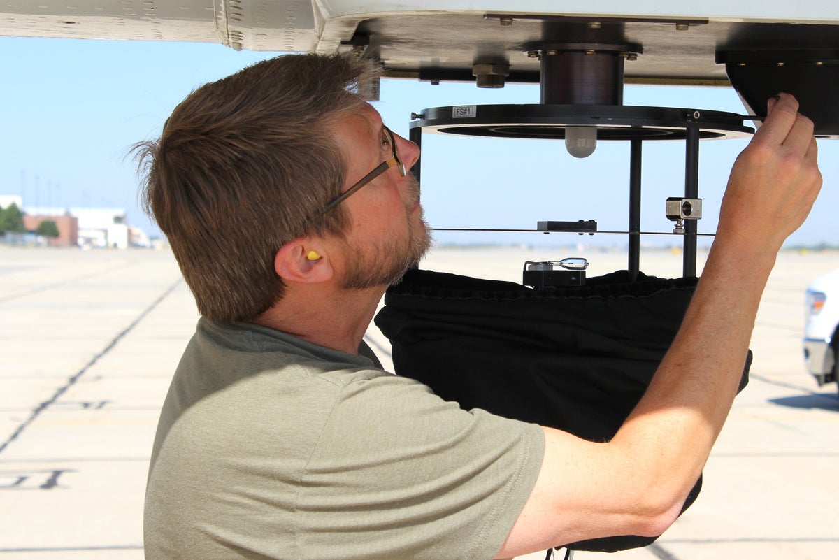 Sam Hall calibrating the CAFS instrument.