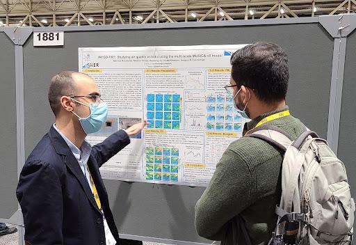 Behrooz Roozitalab (left) presents his poster on studying the air quality in India using MUSICA-v0 at the 2021 Fall AGU Meeting in New Orleans.