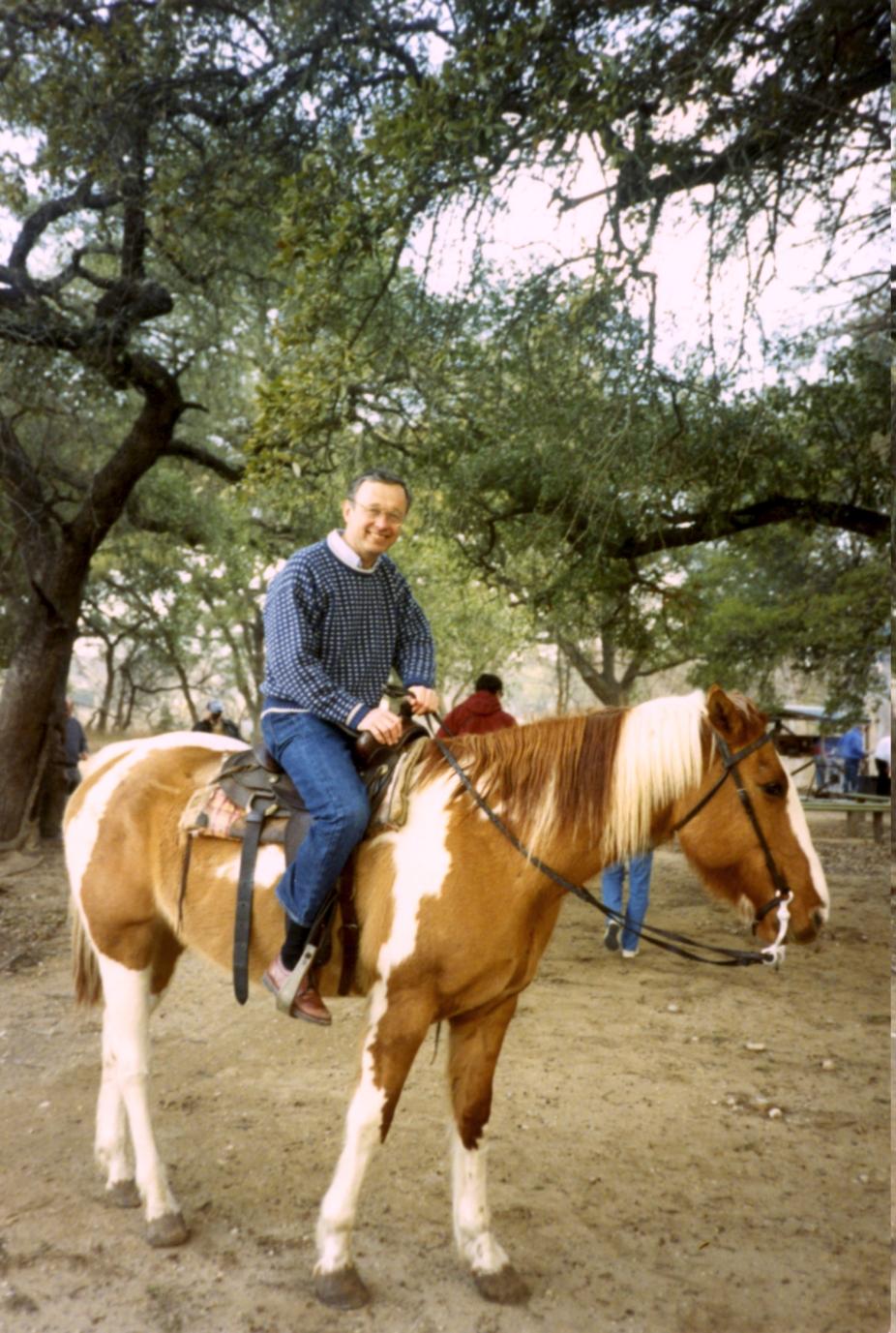 John Gille riding a horse