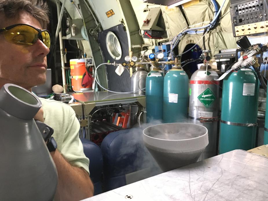 Eric Apel fills the liquid Nitrogen dewar for the TOGA instrument.