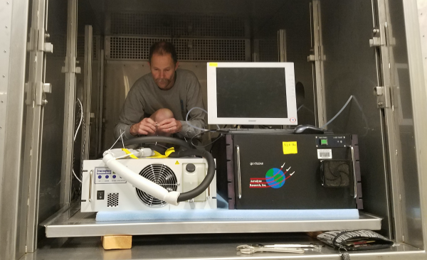 Frank Flocke helping set up the Aerodyne QCL instrument for characterization in the EOL Environmental Chamber.