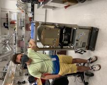  Undergraduate Dylan Simone with instrument rack (Charles Brock)