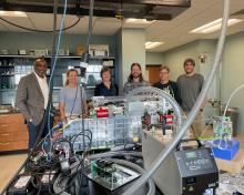 On hand to witness the already functioning instrument were, pictured left to right: NCAR Director Everette Joseph (host), Anne Johansen, ACOM Director Pieternel Levelt, Brett Palm (APROC Project lead), Eric Apel, and Kyle Zarzana (APROC scientist).