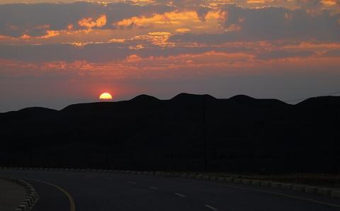  A beautiful sunset over the by-products of copper mining in Mufulira, Zambia, commonly known as The Black Mountain.