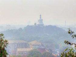 Palaces, avenues, buildings, parks, and scenery around China's Capital. The white Pagoda at Beihai from Jinshan Hill (27 September 2013). Photo by Yinan Chen at Wikimedia Commons.